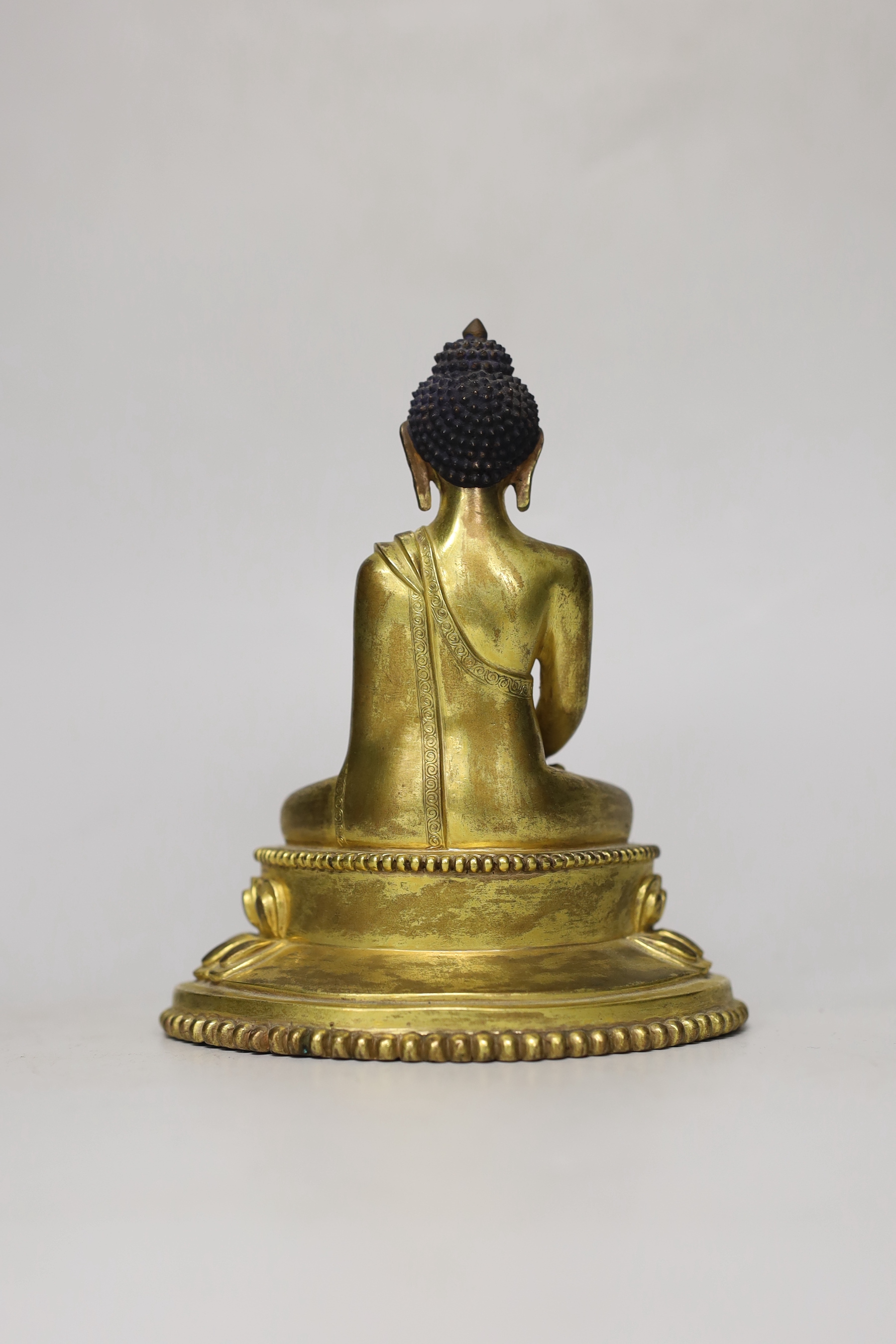 A Sino-Tibetan gilt bronze figure of Buddha Shakuamuni, 16cm